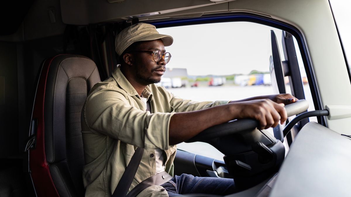 A truck driver back at the wheel